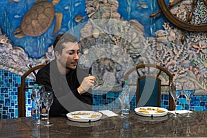 March 26, 2021, Cricova Moldova, young man tasting wine in one of the largest wine cellars in Europe