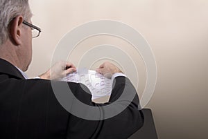 March Madness Businessman Tearing Bracket