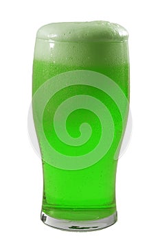 March meme and Happy St patrick`s day concept with frosty glass of frothing green beer and the froth almost spilling over the