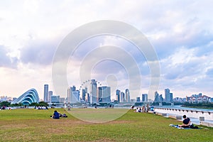 2019 March 1st, Singapore, Marina Barrage - Panorama view of the city buildings and people doing their activities at sunset