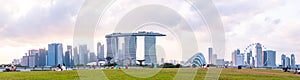 2019 March 1st, Singapore, Marina Barrage - Panorama view of the city buildings and people doing their activities at sunset