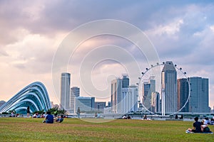 2019 March 1st, Singapore, Marina Barrage - Panorama view of the city buildings and people doing their activities at sunset