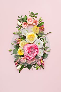 March 8th concept. Number 8 creative layout made of colorful rose flowers on pink background. Greeting Card Women`s Day