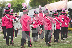 Marching band drummers perform in school