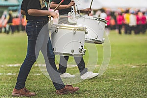 Marching band drummers perform in school