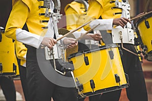 Marching band drummers perform in school parade