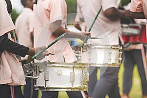 Marching band drummers perform in school parade