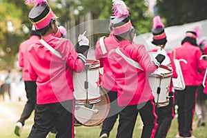 Marching band drummers perform in school parade