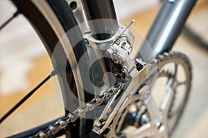 Marco detail view of a sport bicycle`s front derailleur