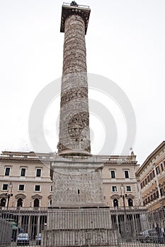 Marcus Aurelius column in front of Palazzo Wedekind at Piazza Colonna in Rome, Italy