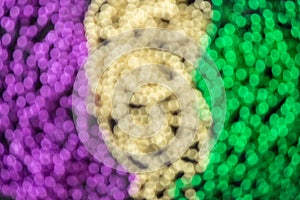 Mardi gras blurry bokeh purple, yellow, green beads background, overlay