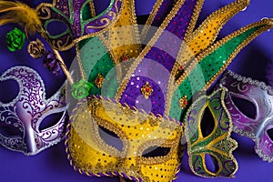 Mardi Gras or carnival mask on purple background