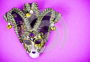 Mardi Gras Festival. Luxurious masquerade Venetian carnival mask on purple background