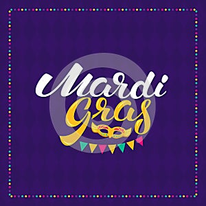 Mardi gras hand drawn lettering and golden fat tuesday mask. Vector greeting card