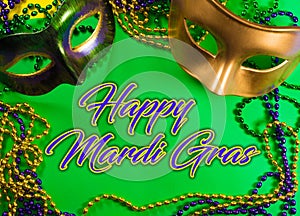Mardi Gras mask with beads on a green background with greeting