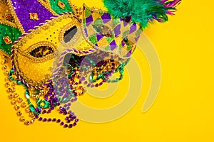 Mardi Gras Mask on yellow Background