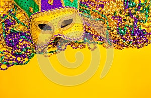 Mardi Gras Mask on yellow Background