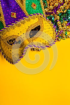 Mardi Gras Mask on yellow Background