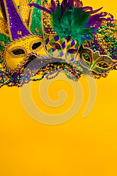 Mardi Gras Masks on yellow Background