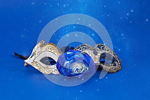 Mardi Gras purim carnivale masquerade mask on blue background with copy space