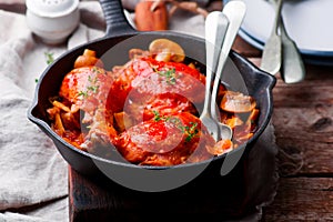 Marengo chicken in a frying pan. . selective focus