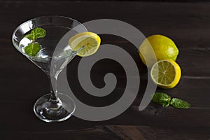 Margarita cocktail in the bar. martini glass of cocktail with olives on wooden background.