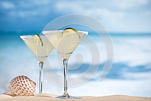 Margarita cocktail on beach, blue sea and sky
