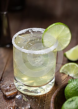 Margarita cocktail with ice, lime and salt riim