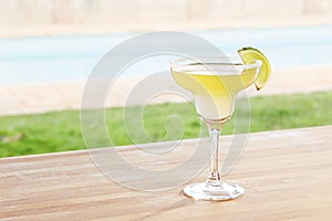 Margarita cocktail by a pool outdoors