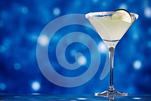 Margarita cocktail on star glitter dark blue background