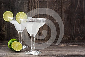 Margarita cocktails on a rustic wooden table