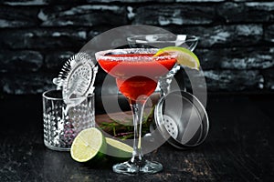 Margarita Strawberry. Alcoholic cocktail. On a wooden background.