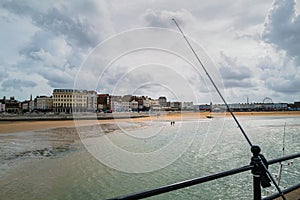 The distictive buildings along the sea front at Margate on cloudy day near the end of summer. A fishing