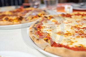 Margherita pizza or Margarita pizza on wooden background. Close up homemade fresh Italian Margherita or Margarita pizza with