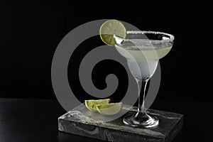 Marguerita cocktail is on the bar. Space for text. Photo for the menu