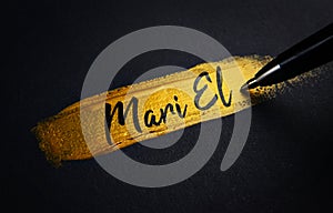 Mari El Handwriting Text on Golden Paint Brush Stroke