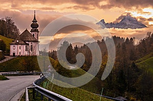 Maria Gern pilgrimage church and mount Watzmann top silhouette through fog, Berchtesgaden, Germany