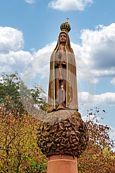 Maria Kronung Gothic statue in churchyard garden, Lautenbach, Germany