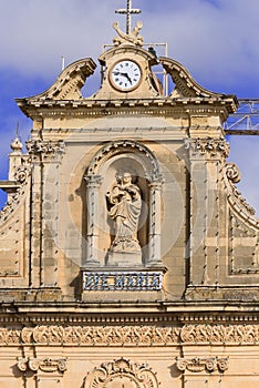 Maria statue on facade of church in Malta