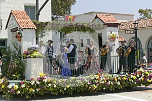 Mariachi Band playing on parade float during opening day parade down State Street, Santa Barbara, CA, Old Spanish Days Fiesta, Aug