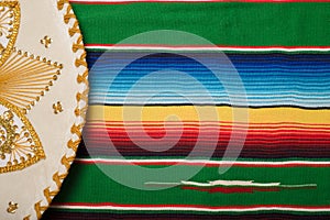 Mariachi hat on colorful serape. Mexican sombrero.