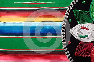 Mariachi hat on colorful serape. Mexican sombrero.