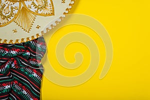 Mariachi hat and serape on yellow background. Mexican concept. Cinco de mayo background