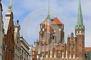 Mariacka street with colorful facades of tenement houses and St.Mary`s Church, Gdansk, Poland