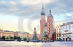 Mariacki Cathedral at Market square in Krakow at the center of old town at sunrise, Poland photo