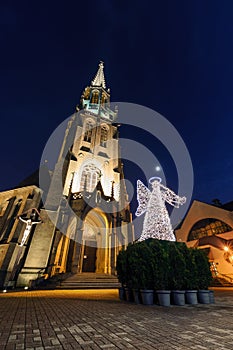 Mariacki church with angel in christmas night. Katowice