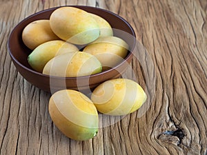 Marian plum in wooden bowl