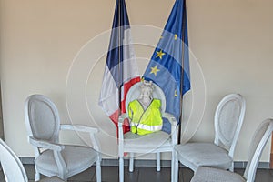 Marianne symbol of the French Republic with a yellow vest gilet jaune presiding at the national consultation of the Big national