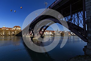 Maribor, Slovenia - January 02, 2020: Drava river, sky reflection and bridge. The Main Bridge across Drava river in Maribor,