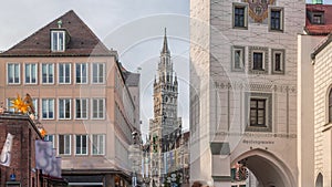 Marienplatz with the old Munich town hall, Rathaus-Glockenspiel and the Talburg Gate timelapse, Bavaria, Germany.